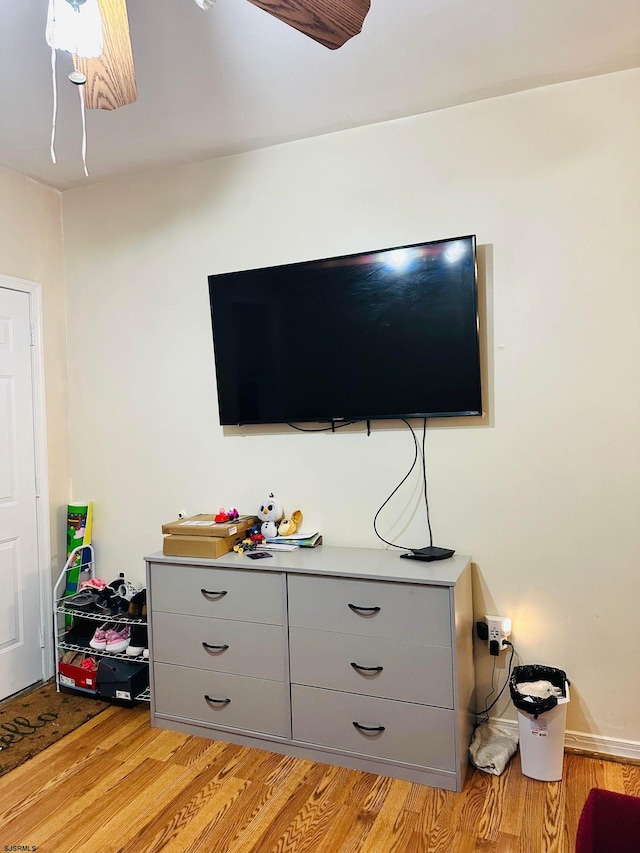 interior space featuring ceiling fan and hardwood / wood-style flooring