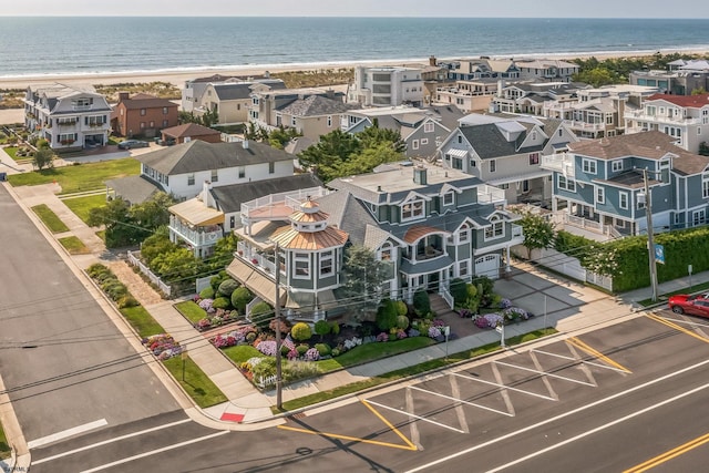 aerial view with a water view and a view of the beach