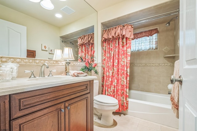 full bathroom with vanity, toilet, tile patterned floors, and shower / bath combo with shower curtain