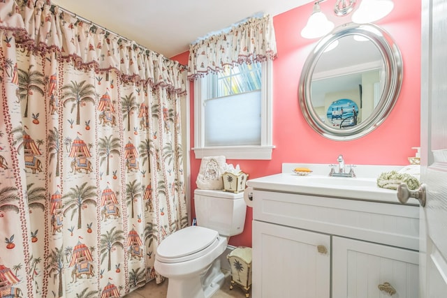 bathroom with vanity, toilet, and a shower with shower curtain