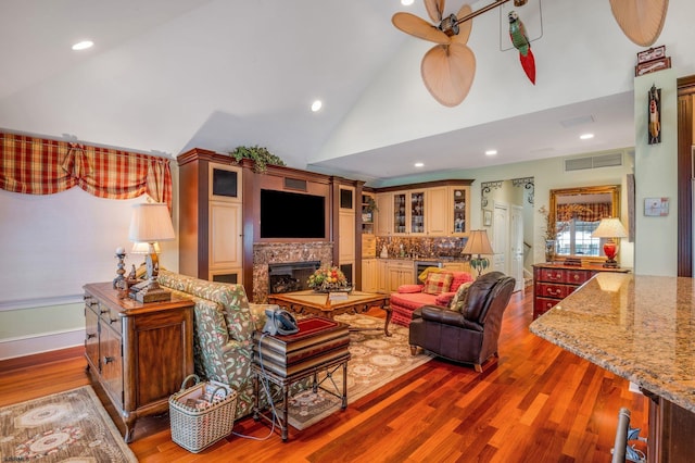 living room featuring high vaulted ceiling, wood-type flooring, ceiling fan, and beverage cooler