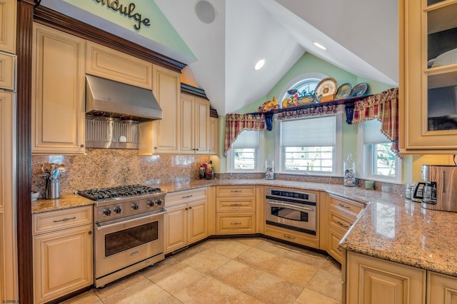 kitchen featuring ventilation hood, light stone countertops, light tile patterned floors, and stainless steel appliances