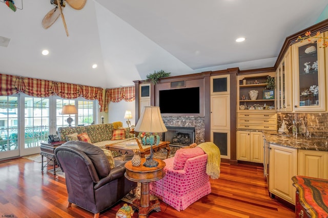 living room with lofted ceiling and dark wood-type flooring