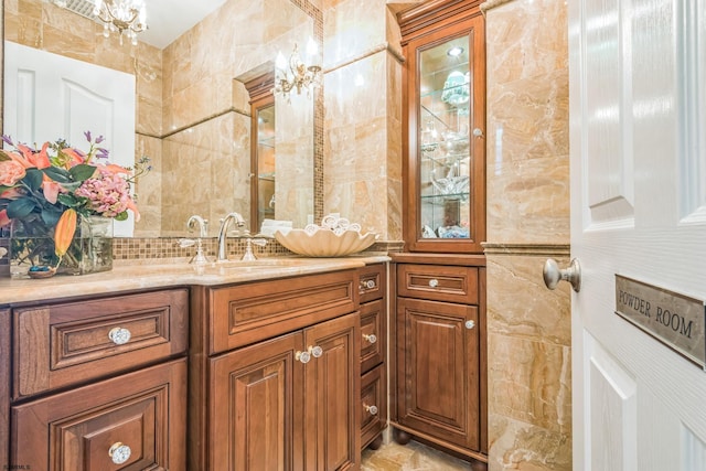 bathroom with tile patterned flooring, tile walls, and vanity