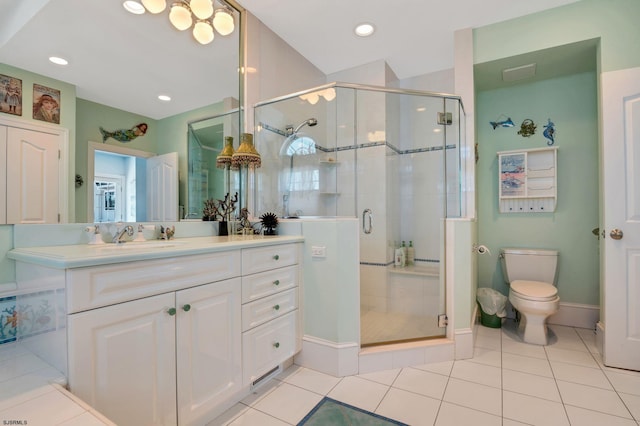 bathroom featuring vanity, toilet, an enclosed shower, and tile patterned floors