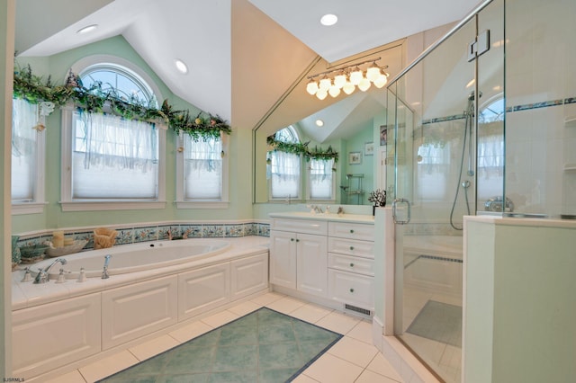 bathroom featuring lofted ceiling, vanity, separate shower and tub, and tile patterned floors