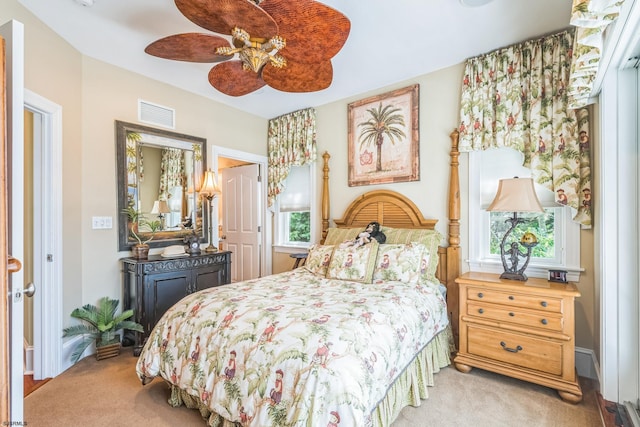 carpeted bedroom with ceiling fan