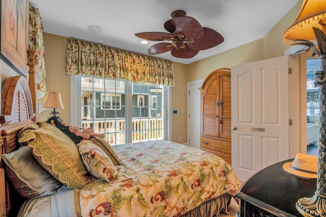 bedroom with ceiling fan and access to outside