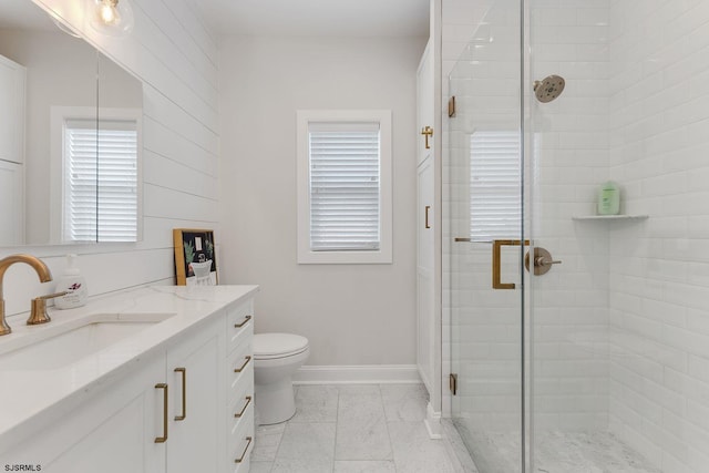 bathroom with vanity, toilet, walk in shower, and tile patterned floors