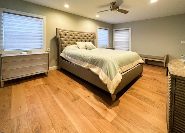 bedroom featuring ceiling fan and light wood-type flooring