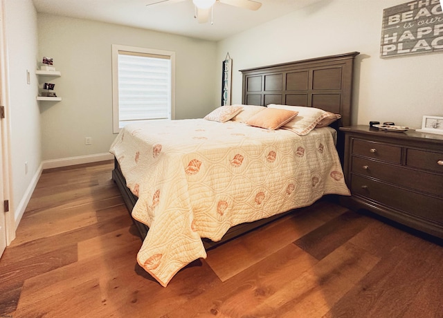 bedroom featuring ceiling fan and hardwood / wood-style flooring