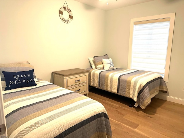 bedroom featuring wood-type flooring