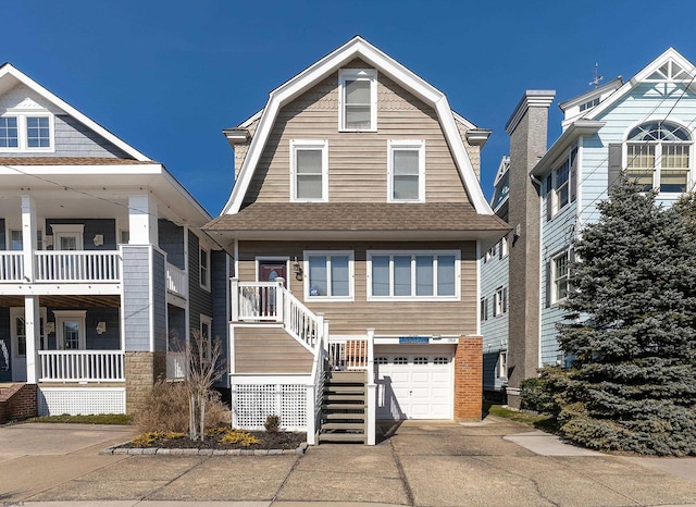 view of front of home with covered porch and a garage