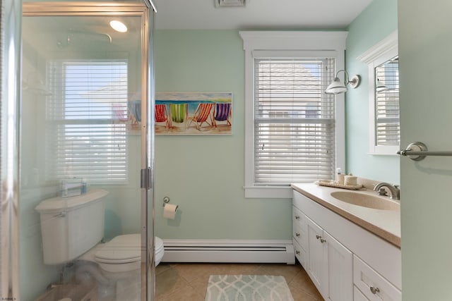 full bath with toilet, vanity, baseboard heating, and tile patterned floors