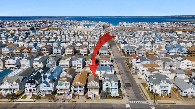 aerial view featuring a water view and a residential view