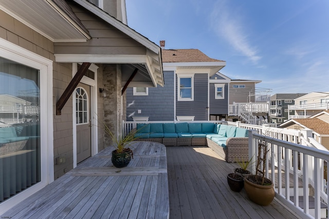 wooden deck with a residential view and an outdoor hangout area