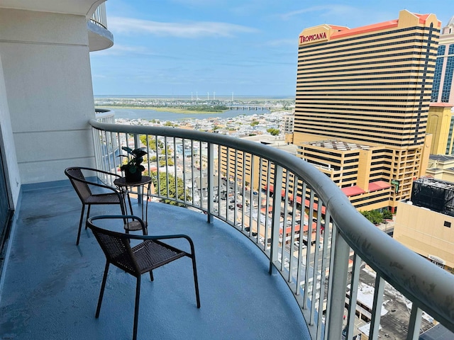 balcony featuring a water view