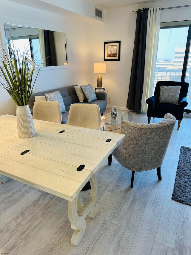 living room with light hardwood / wood-style flooring