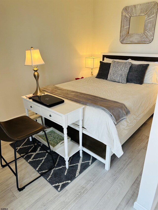 bedroom featuring light hardwood / wood-style flooring