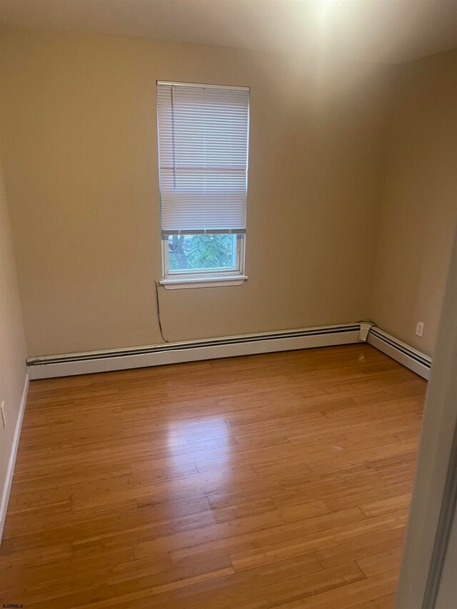 unfurnished room featuring light wood-type flooring