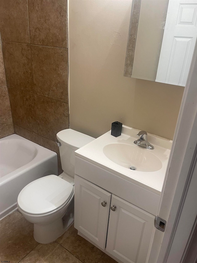 bathroom featuring tile patterned floors, toilet, and vanity