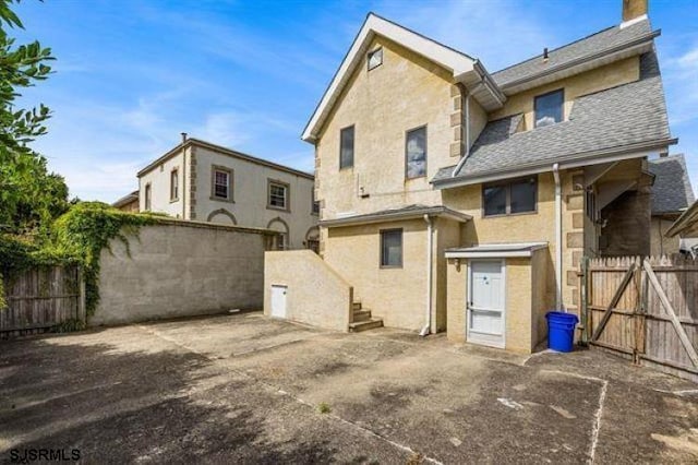 back of house with a patio area