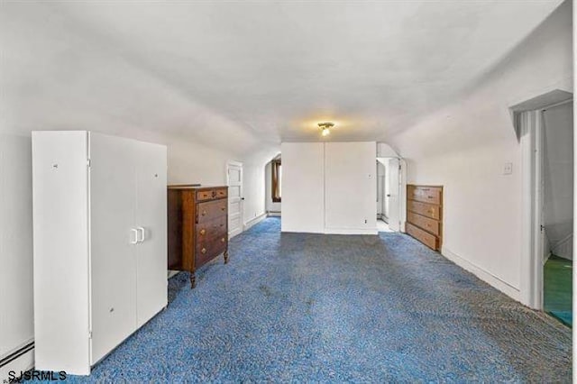 bonus room with a baseboard heating unit