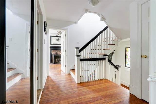 corridor featuring hardwood / wood-style floors