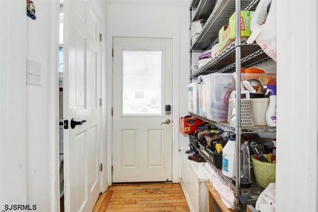 mudroom with light hardwood / wood-style flooring