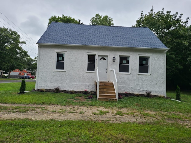 bungalow with a front lawn