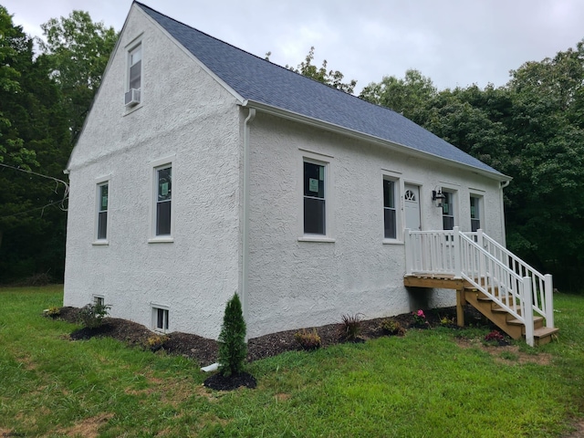 view of property exterior with a yard