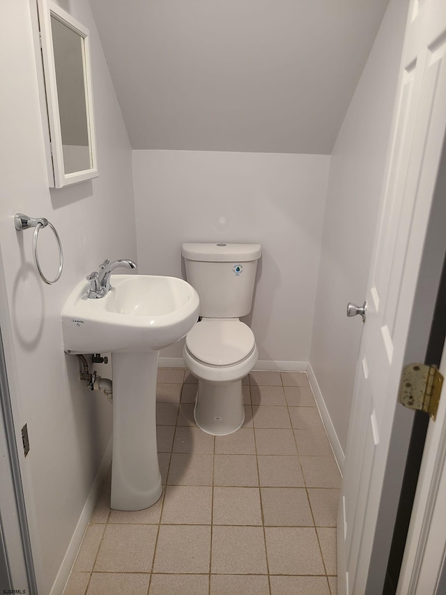 bathroom featuring toilet and tile patterned floors