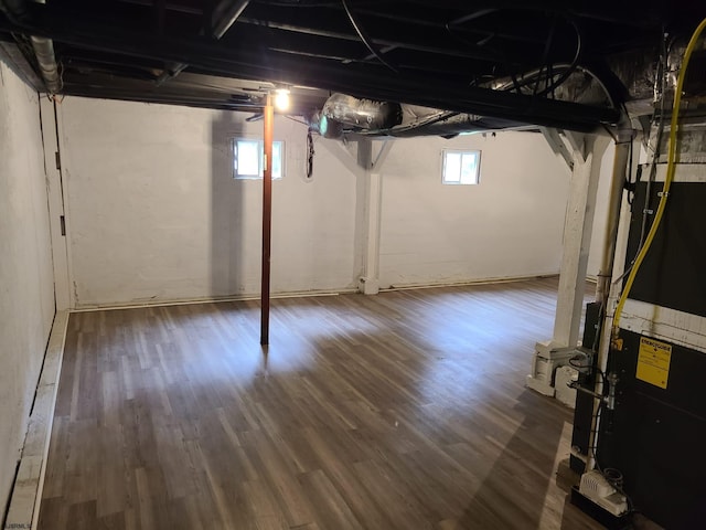 basement with dark wood-type flooring