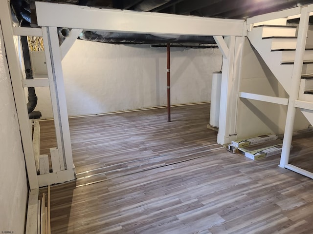 basement featuring hardwood / wood-style floors