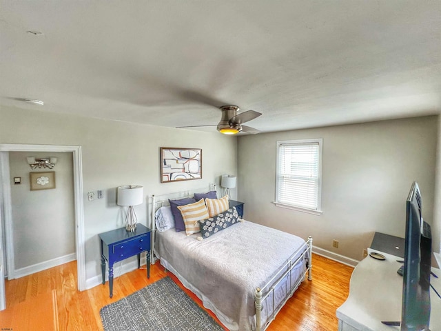 bedroom featuring hardwood / wood-style floors and ceiling fan