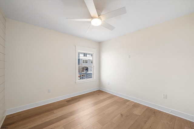 unfurnished room with ceiling fan and light hardwood / wood-style floors