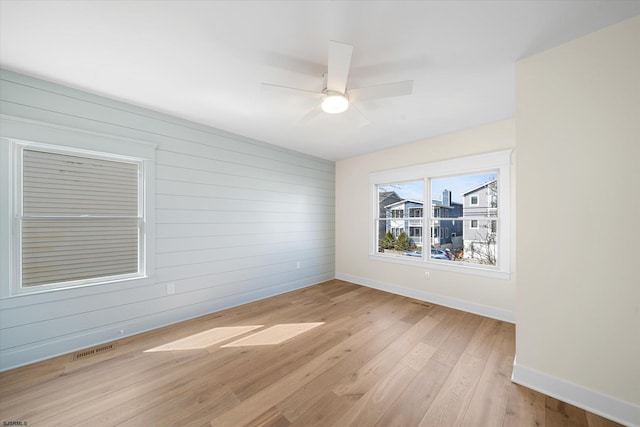 unfurnished room featuring ceiling fan and light hardwood / wood-style floors