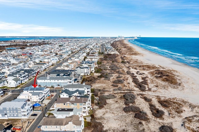 bird's eye view featuring a beach view and a water view