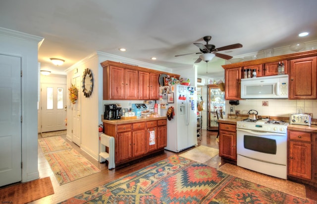 kitchen featuring crown molding, white appliances, ceiling fan, and light hardwood / wood-style floors