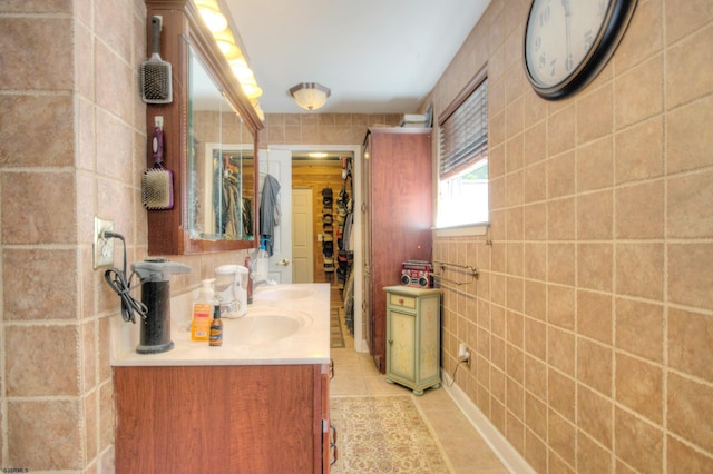 bathroom featuring vanity, tile walls, and tile patterned floors