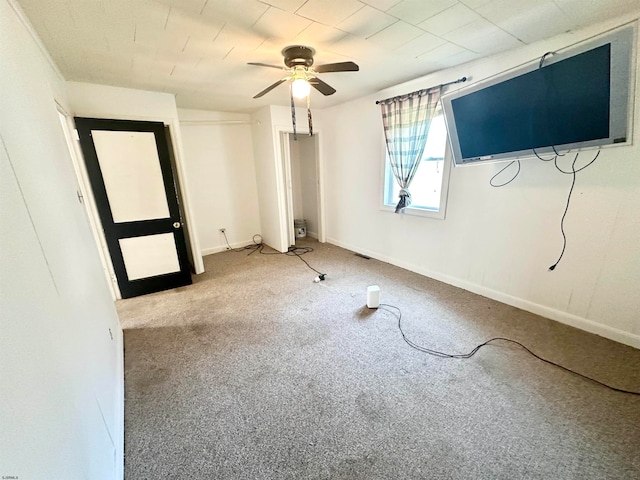 unfurnished bedroom with light colored carpet and ceiling fan