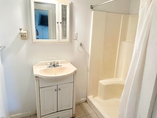 bathroom with vanity, a shower with curtain, and tile patterned floors