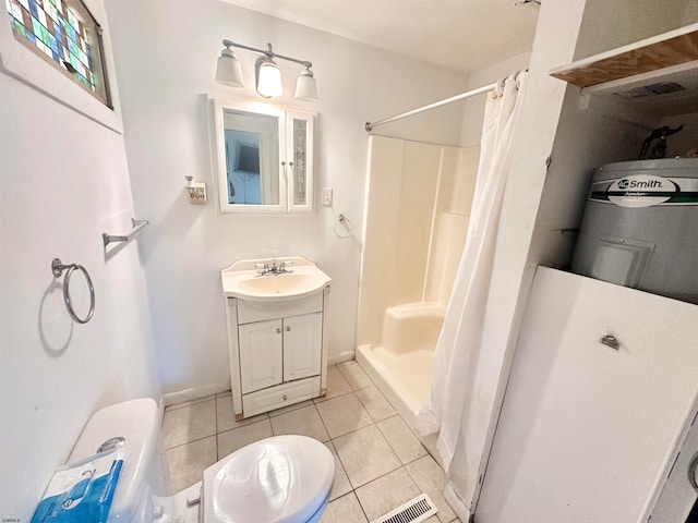 bathroom featuring vanity, toilet, tile patterned floors, and walk in shower