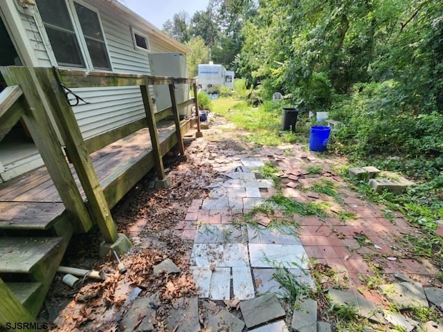 view of yard with a wooden deck