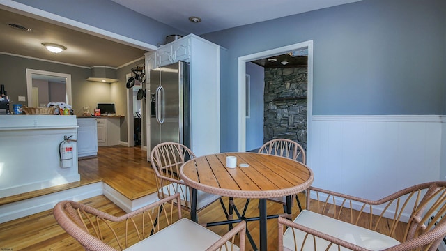 dining space featuring wood-type flooring