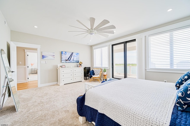 bedroom with access to exterior, ceiling fan, carpet floors, and multiple windows