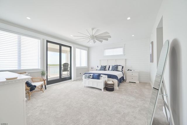 carpeted bedroom featuring ceiling fan and access to outside