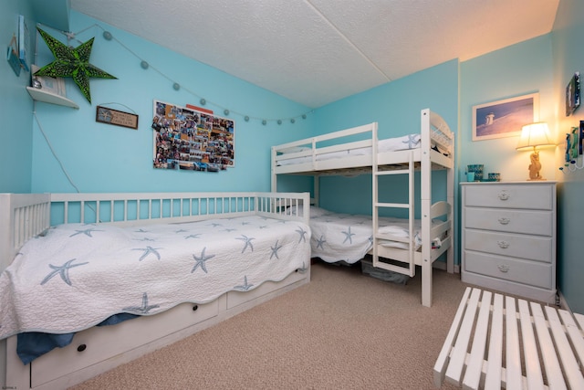 carpeted bedroom featuring a textured ceiling