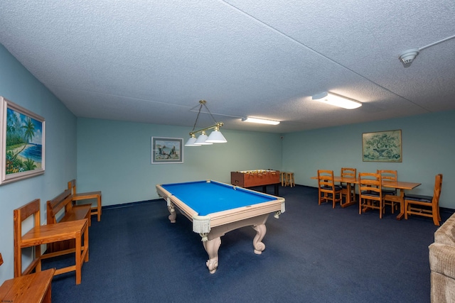 rec room featuring dark colored carpet, pool table, and a textured ceiling