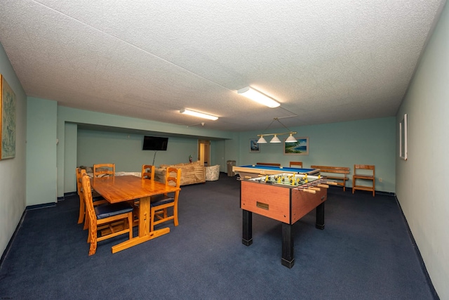 rec room with dark carpet, a textured ceiling, and billiards